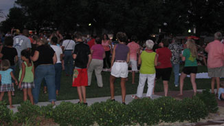 The fans practice their moves prior to Electric Slide